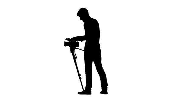 Operator stands, camera on tripod at hip level White background — Stock Video