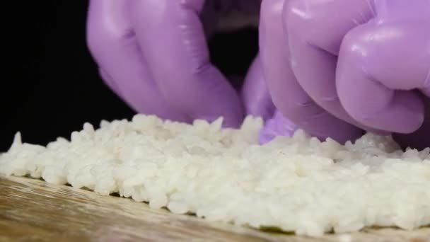 Cook turns the nori with rice. Close up — Stock Video