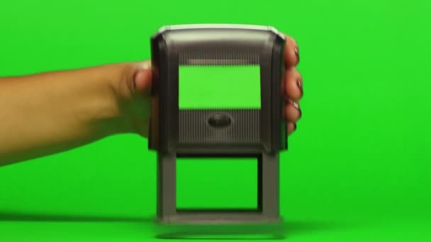 Woman puts print stamp on documents. Close up. Green screen — Stock Video
