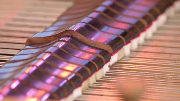 Hammers striking strings inside piano — Stock Video