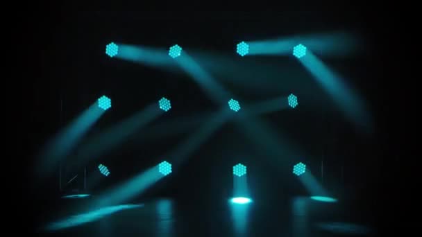 Stage with spot lighting. Shining empty scene for holiday show, award ceremony or theatrical performance on turquoise background. Dynamic lighting effects. — Stock Video