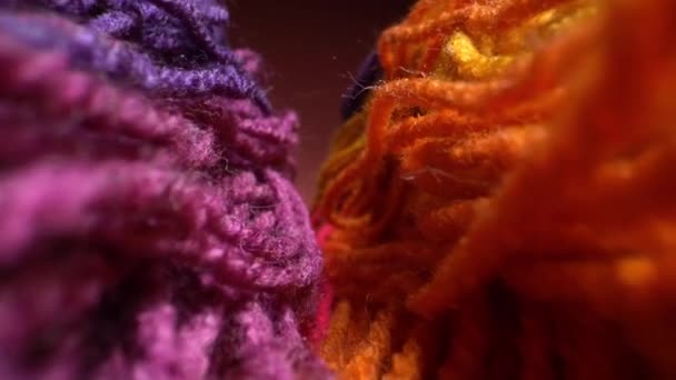 Camera moves above rows of colored woolen threads for knitting. Wool texture close up. Super macro shot. — Stock Video