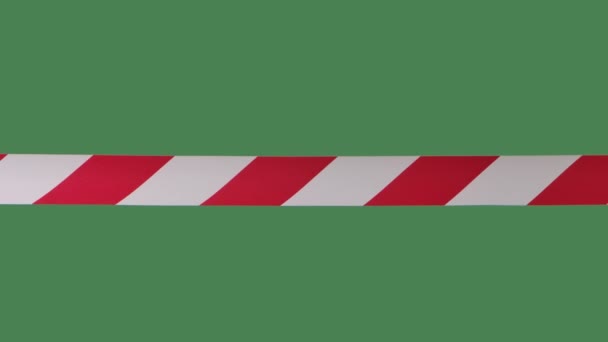 Signal red and white stripes, artificial fence to restrict. It is forbidden to cross the danger zone. Quarantine precautions. Close up in slow motion. — Stock Video