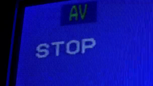 Macro shot of an old analog TV screen. Analogue retro TV settings menu in extreme close up. Blue pixel background. Retro tv. — Stock Video