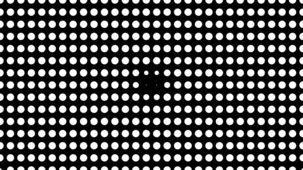 White polka dots against black background. Concentric growing circles seamless loop transition — Stock Video