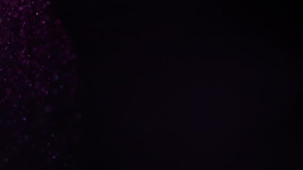 Beautiful sparkle bokeh on a black background in pink light. Slow motion. — Stock Video
