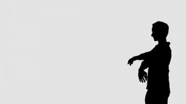 Bale yapan bir adamın silueti. Klasik baleden zarif bir dans öğesi