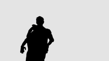 Siluet profesyonel bale çifti karanlık sahnede dans ediyor. Her harekette zarafet ve şefkat..