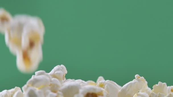 Fresh popcorn falls on top of a pile Isolated on ChromaKey Background — Αρχείο Βίντεο