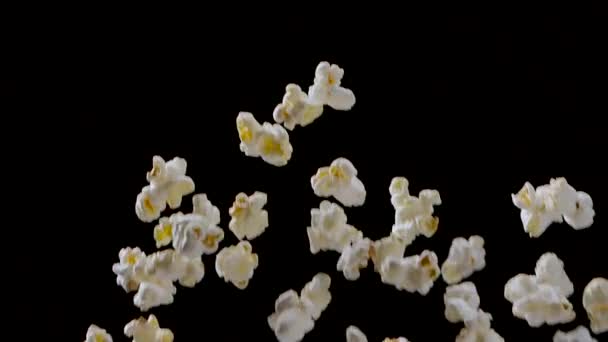 Popping Popcorn Flying and Falling Isolated on Black Background — Vídeo de Stock