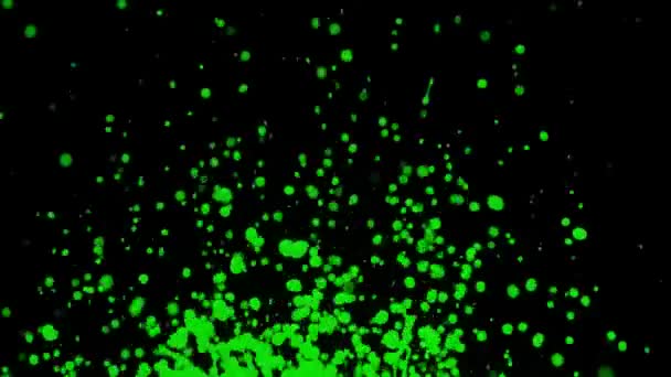Les éclaboussures vertes de peinture tombent au ralenti. Tourné avec caméra de cinéma à grande vitesse. Fond noir.