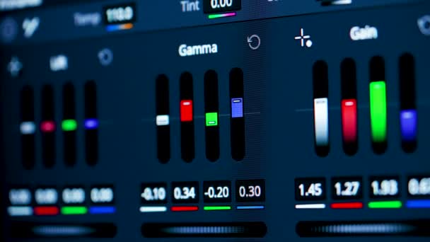 Color correction post production video or photo in progress close up. A program for video processing, gamma, gain, offset correction. Mixing panel. Colored bar, macro. — 비디오