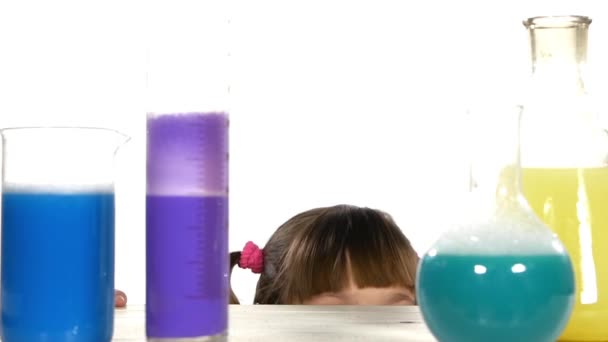 Girl stands up and smiling among tubes — Stock Video