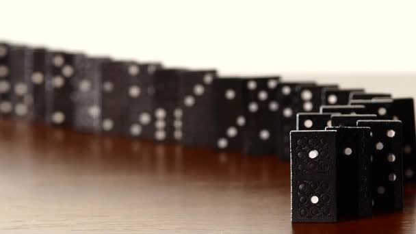 Domino, isolated on white, dynamic change of focus, slow motion — Stock Video