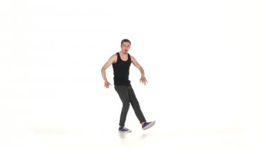 Young b-boy man doing brake dancing movements, on white, slow motion