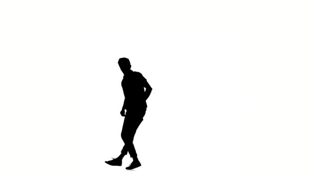 Modern style dancer starts dancing brake-dance, on white, slow motion, silhouette — Stock Video