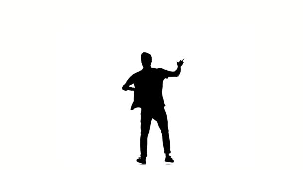 Young hip-hop man in shirt doing brake dancing movements, on white, slow motion, silhouette — Αρχείο Βίντεο