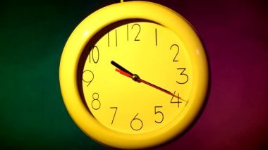 yellow clock on colorful background