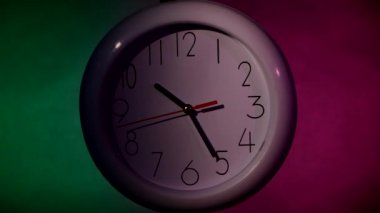 white Clock on color wooden plank wall, night Light