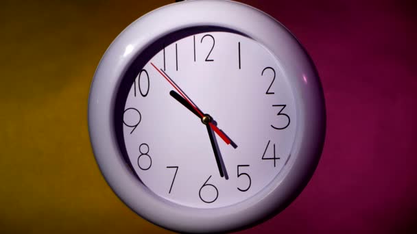 White clock on colorful background — Stok video