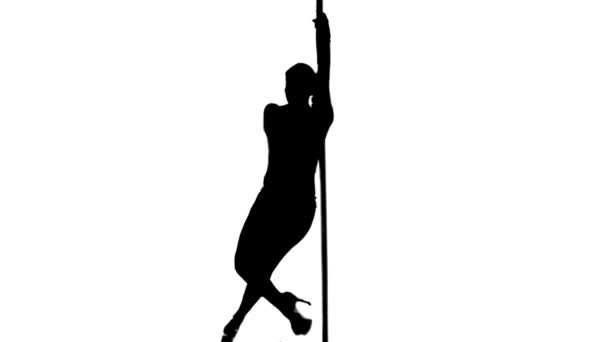 Une femme caucasienne pole danseuse dansant en studio silhouette isolé sur fond blanc — Video