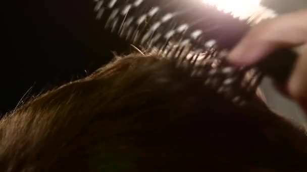 Barbers: Master makes styling with hair dryer and a comb. close-up, Slow motion — Stock Video