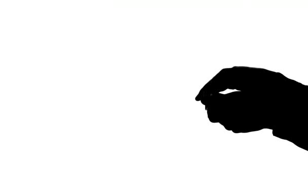 Mains de magicien homme montrant son tour de carte, silhouette 