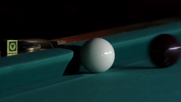 White ball falls into a pocket billiard after impact. Slow motion — Stockvideo