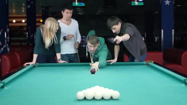 Young man doing kick on a billiard ball. Slow motion — ストック動画