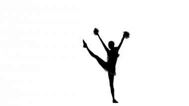 Young cheerleader with pom-poms smiling at camera, acrobatic wheel double, Silhoutte