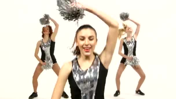 Girl in black costume  with pom-poms dancing on  white background. Close up — Stock Video