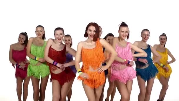 Girls dancing synchronously in colorful dresses,pom-poms in hand. slow motion