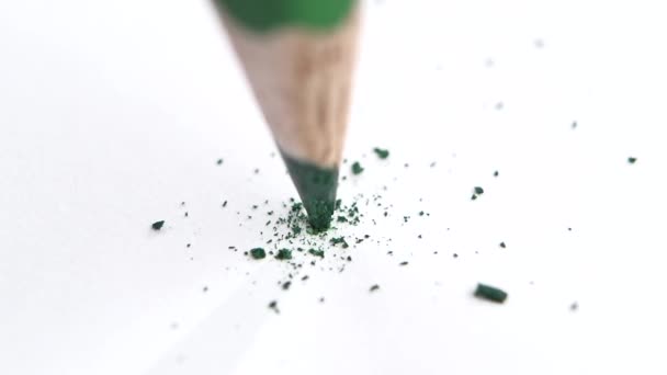 Broken head of sharp green pencil on a white, slow motion — Stock Video