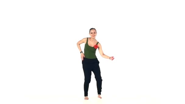 Young social latin dancer girl making moves dancing, on white, slow motion — Wideo stockowe