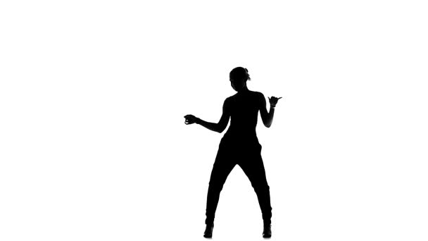 Young social latin dancer continue dancing, on white, slow motion, silhouette — Αρχείο Βίντεο