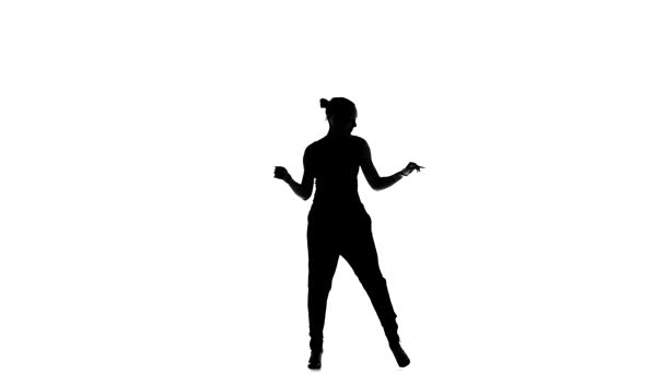 Young social latin dancer girl continue moving dancing, on white, slow motion, silhouette — Αρχείο Βίντεο