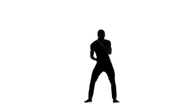 Happy afro american man dancer dancing barefoot latina dance on white, slow motion, silhouette — Stock Video