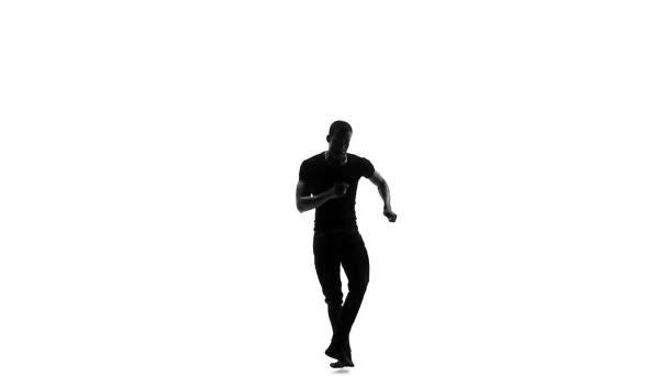 Afro American man dansare med naken torso dansar Latina Dans på vit, slow motion, siluett — Stockvideo