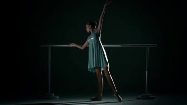 Young ballet dancer wearing an apricot tutu. slow motion