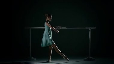 Young ballet dancer wearing an apricot tutu. slow motion