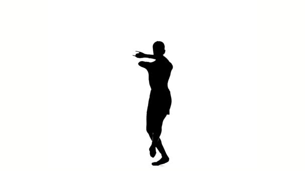 petite fille ballerine posant sur un fond blanc. silhouette. au ralenti 