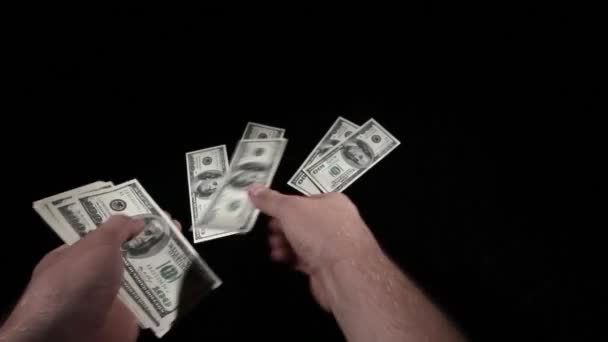 Considers money isolated on black background — Stock Video