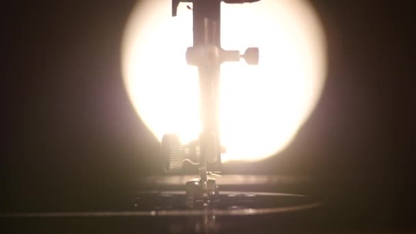 Part of antique working silver sewing machine, back light, slow motion, close up — Stock Video