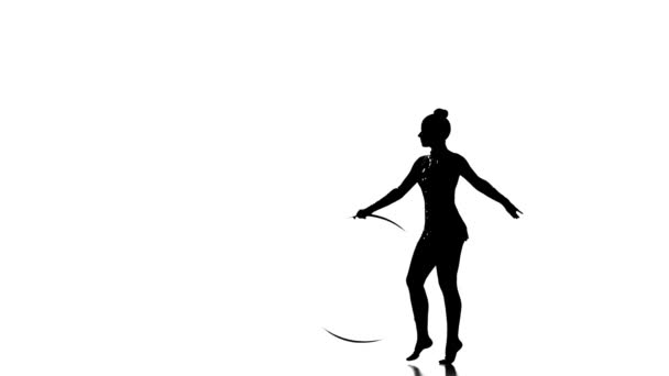 Silhouettes Young gymnast doing tricks with hoop, slow motion — Stock Video