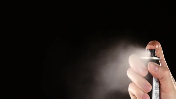 Aerosol can of spray straight on black, slow motion — Stockvideo