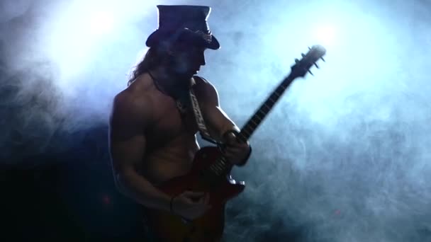 Emotional strip man playing bass guitar, slow motion, smoke — Stock Video