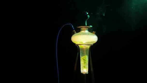 Beautiful yellow hookah with the smoke on black, slow motion — Stock Video