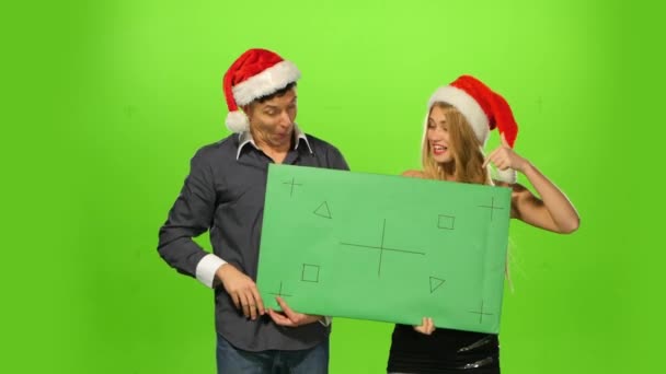 Couple celebrating new year eve. green screen, blank sign — Stock Video