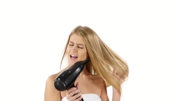 Woman in bathroom drying hair with blow dryer. slow motion, bathroom — 图库视频影像