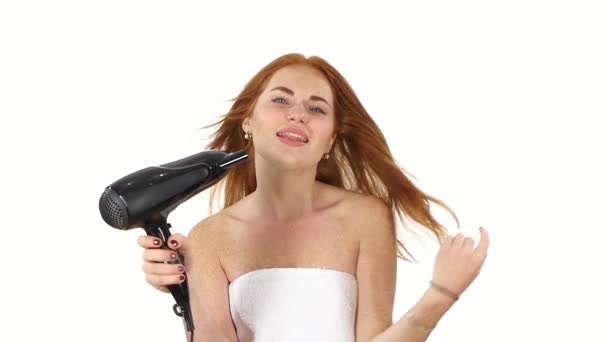 Young Redhead girl singing while blow-dry. Close up. slow motion, bathroom — Stock Video